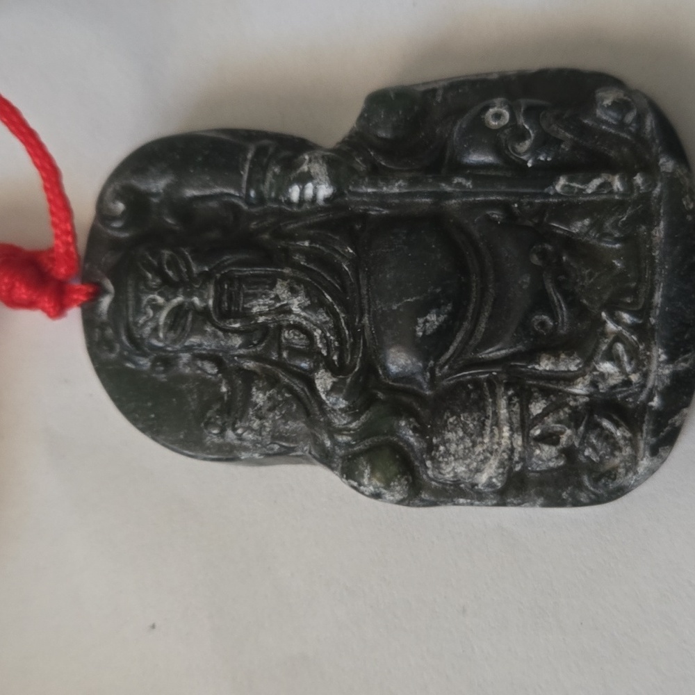 Dark green burma jade piece